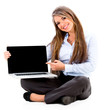 Business woman pointing on a laptop