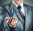 Small businessman in hand