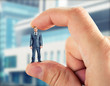Small businessman in hand