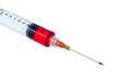 Plastic disposable syringe filled with red liquid.