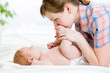 happy mother having fun with her baby boy infant