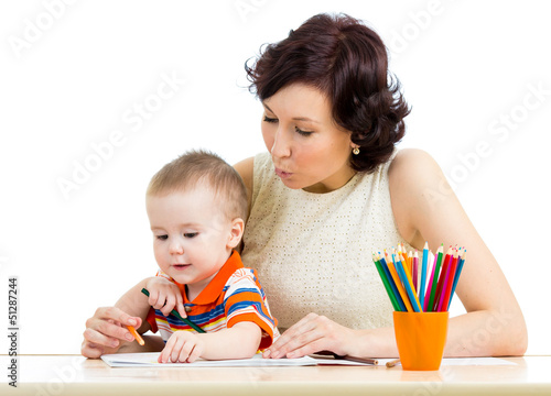 Photo: baby boy and mother drawing with colorful pencils baby boy and mother drawing with colorful pencils