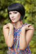 Fashion brunette woman with makeup and hairstyle