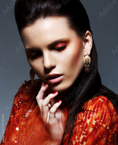 Photo: Inspiration. Woman in Glossy Dress in Reverie. Sparkle. Glitter Inspiration. Woman in Glossy Dress in Reverie. Sparkle. Glitter