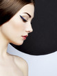 Conceptual fashion portrait of a beautiful young woman