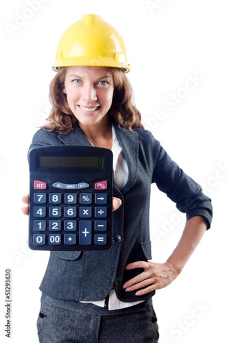Photo: Female builder with calculator on white Female builder with calculator on white