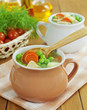 Soup with meat and green peas