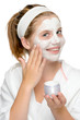 Applying face mask fingers smiling blonde girl