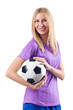 Foto: Woman playing football on white Woman playing football on white