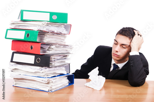 Photo: Young busy businessman at his desk Young busy businessman at his desk