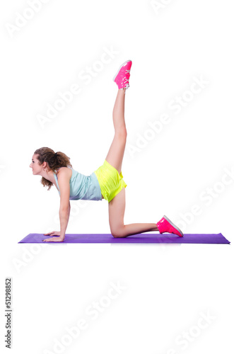 Photo: Young female doing exercises on white Young female doing exercises on white