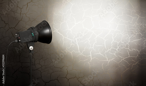 Photo: spot light on concrete wall spot light on concrete wall