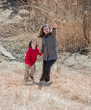 Hispanic Mother Guiding Her Son Through the Wilderness