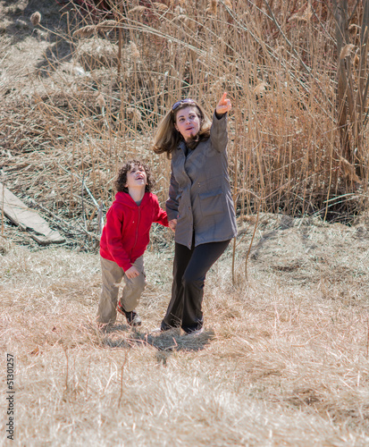 Photo: Hispanic Mother Guiding Her Son Through the Wilderness Hispanic Mother Guiding Her Son Through the Wilderness