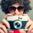 Young Female Photographer with Camera