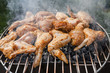 Grilled chicken thigh on the flaming grill 