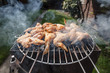 Grilled chicken thigh on the flaming grill 