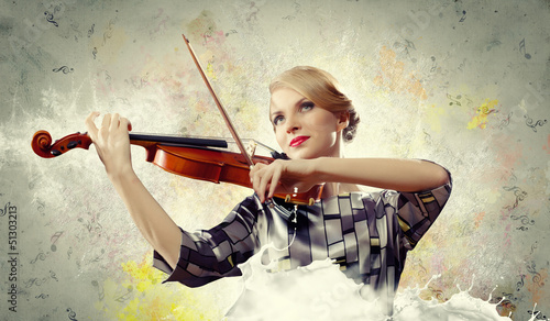 Photo: Gorgeous woman playing on violin Gorgeous woman playing on violin