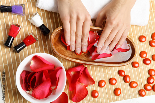 Photo: Woman is getting manicure Woman is getting manicure