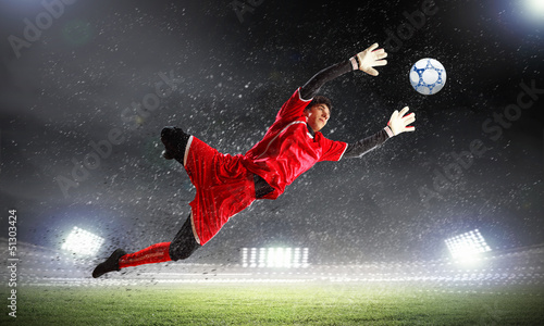 Photo: Goalkeeper catches the ball Goalkeeper catches the ball