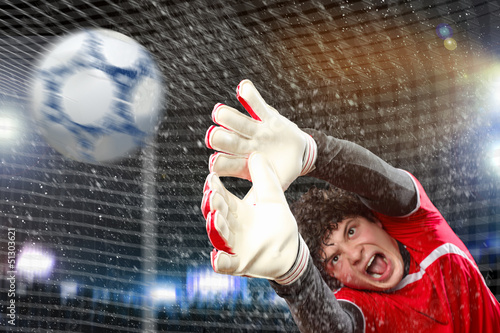 Photo: Goalkeeper catches the ball Goalkeeper catches the ball
