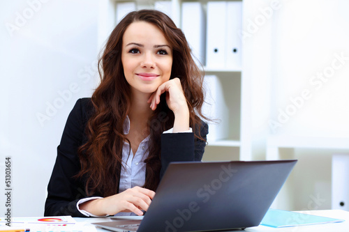 Photo: Young busines woman with notebook Young busines woman with notebook
