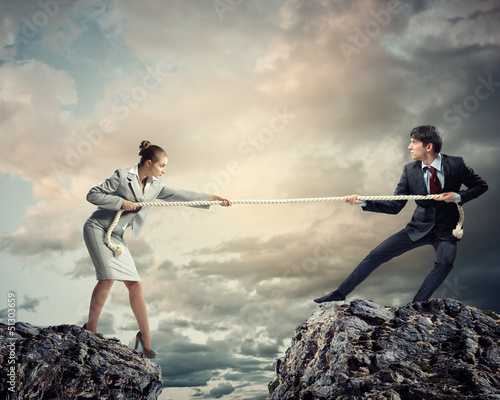Photo: People pull the rope. People pull the rope.