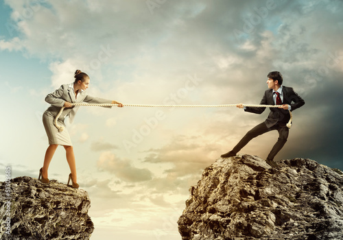 Photo: People pull the rope. People pull the rope.
