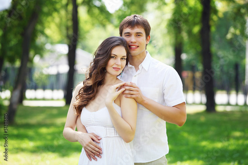 Photo: Young love Couple smiling under blue sky Young love Couple smiling under blue sky