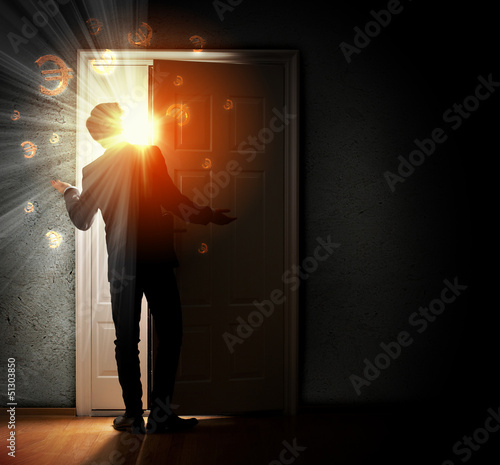 Photo: Young businessman opening door Young businessman opening door
