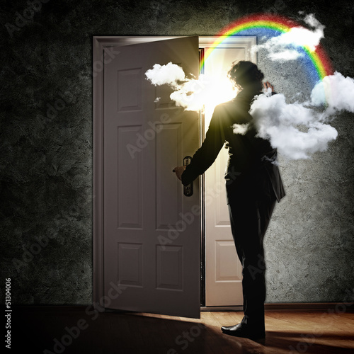 Photo: Young businessman opening door Young businessman opening door