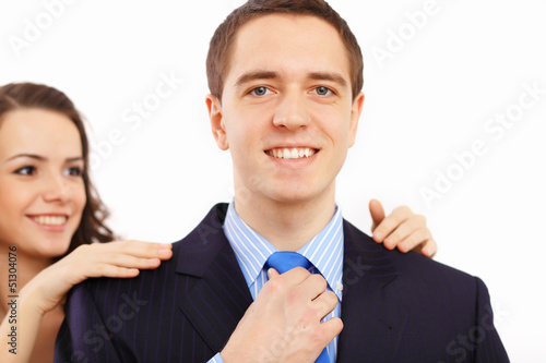 Photo: Businessman dressing at home in the morning Businessman dressing at home in the morning