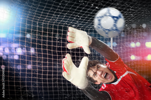 Photo: Goalkeeper catches the ball Goalkeeper catches the ball