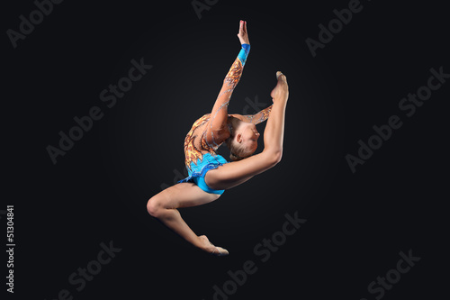 Photo: Young woman in gymnast suit posing Young woman in gymnast suit posing