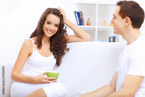 Photo: Young happy couple at hone together s Young happy couple at hone together s