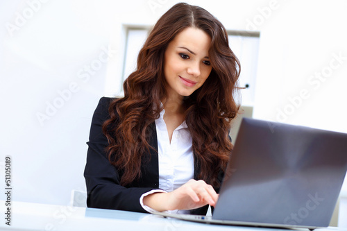 Photo: Young busines woman with notebook Young busines woman with notebook