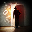 Young businessman opening door