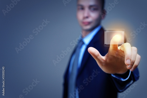 Photo: Business man touching display Business man touching display