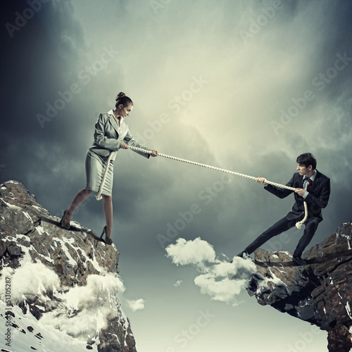 Photo: People pull the rope. People pull the rope.