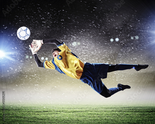 Photo: Goalkeeper catches the ball Goalkeeper catches the ball