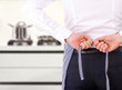 Businessman tying apron strings.