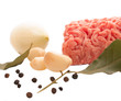 Minced meat with spices and garlic on white background