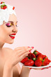Woman eating strawberry