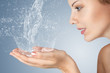 Foto: Young woman washing her face Young woman washing her face