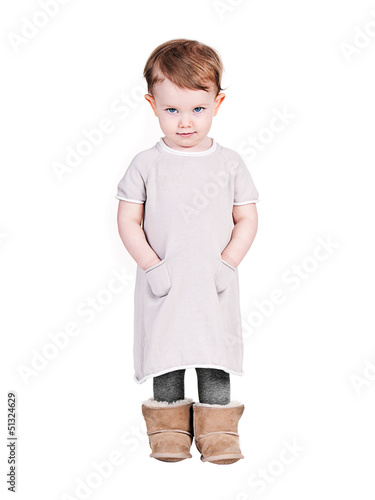Photo: Cute Infant in Dress on White Background Cute Infant in Dress on White Background
