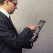 Photo: Finger pointing on digital tablet Finger pointing on digital tablet