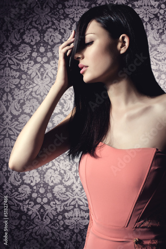 Photo: beautiful brunette woman with elegant hairstyle wearing nice cor beautiful brunette woman with elegant hairstyle wearing nice cor