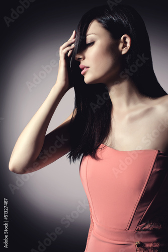 Photo: beautiful brunette woman with elegant hairstyle wearing nice cor beautiful brunette woman with elegant hairstyle wearing nice cor