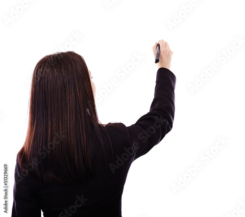 Photo: Businesswoman writing on invisible object Businesswoman writing on invisible object