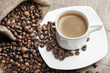 Photo: coffee cup with coffee beans coffee cup with coffee beans